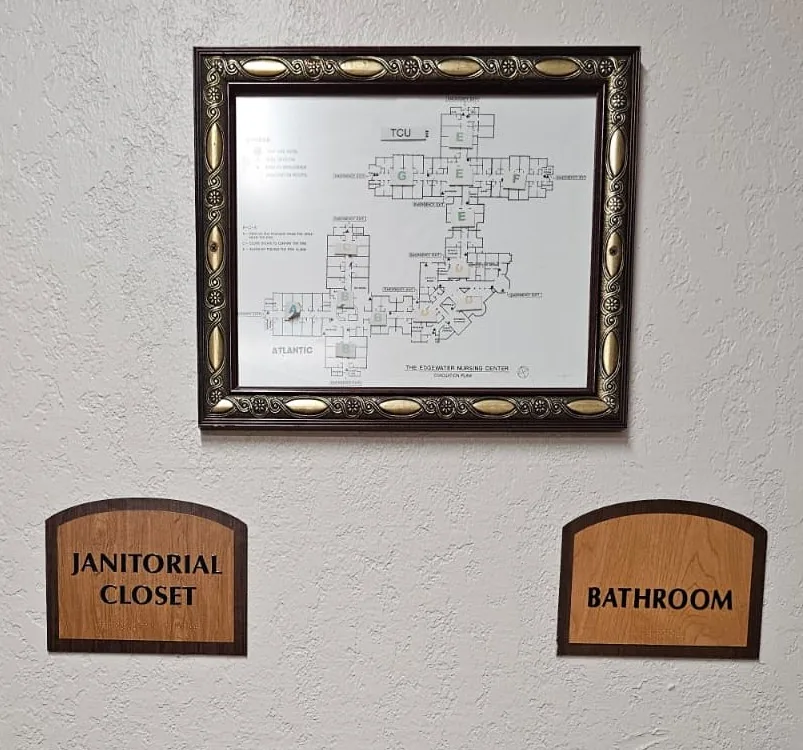 ADA room identification signs with Braille for a janitorial closet and bathroom, wall-mounted next to the door