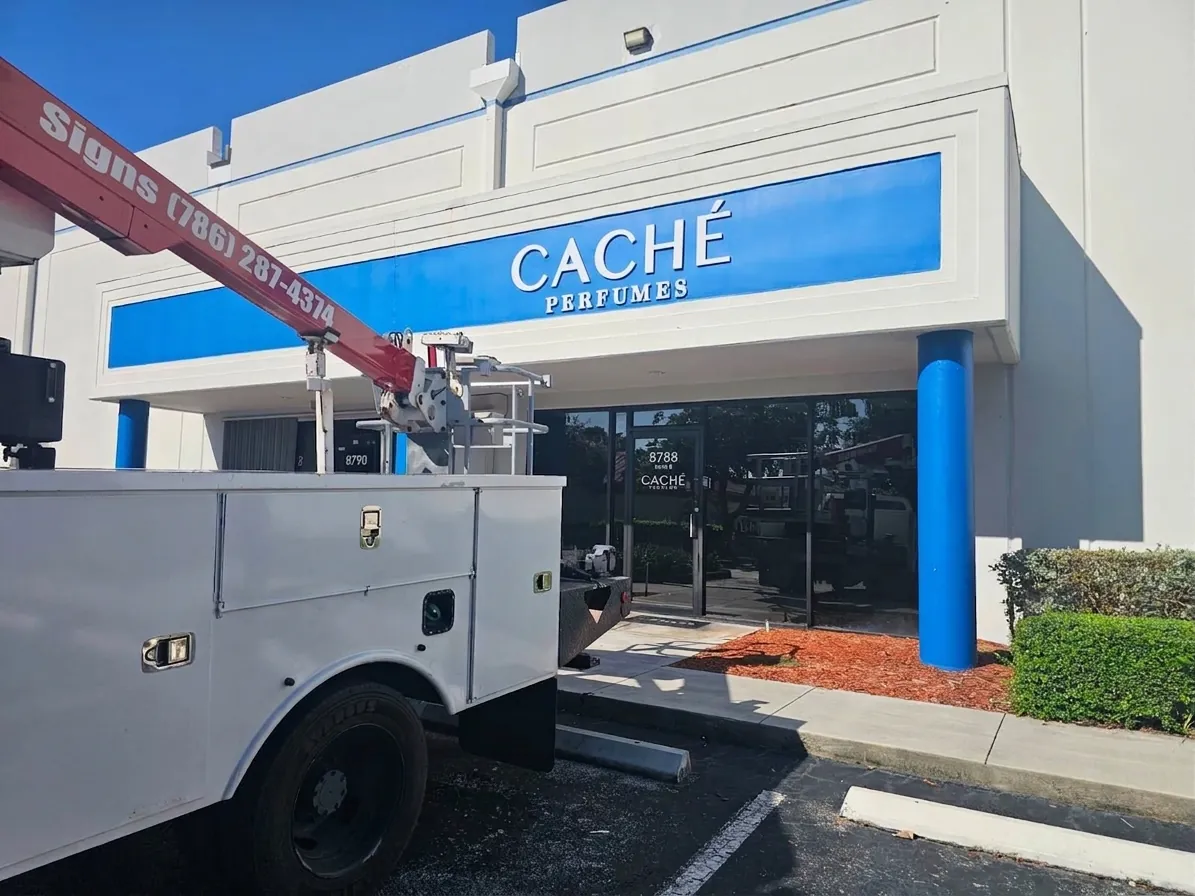 Caché Perfumes building sign dimensional letters being installed by Spazio Design