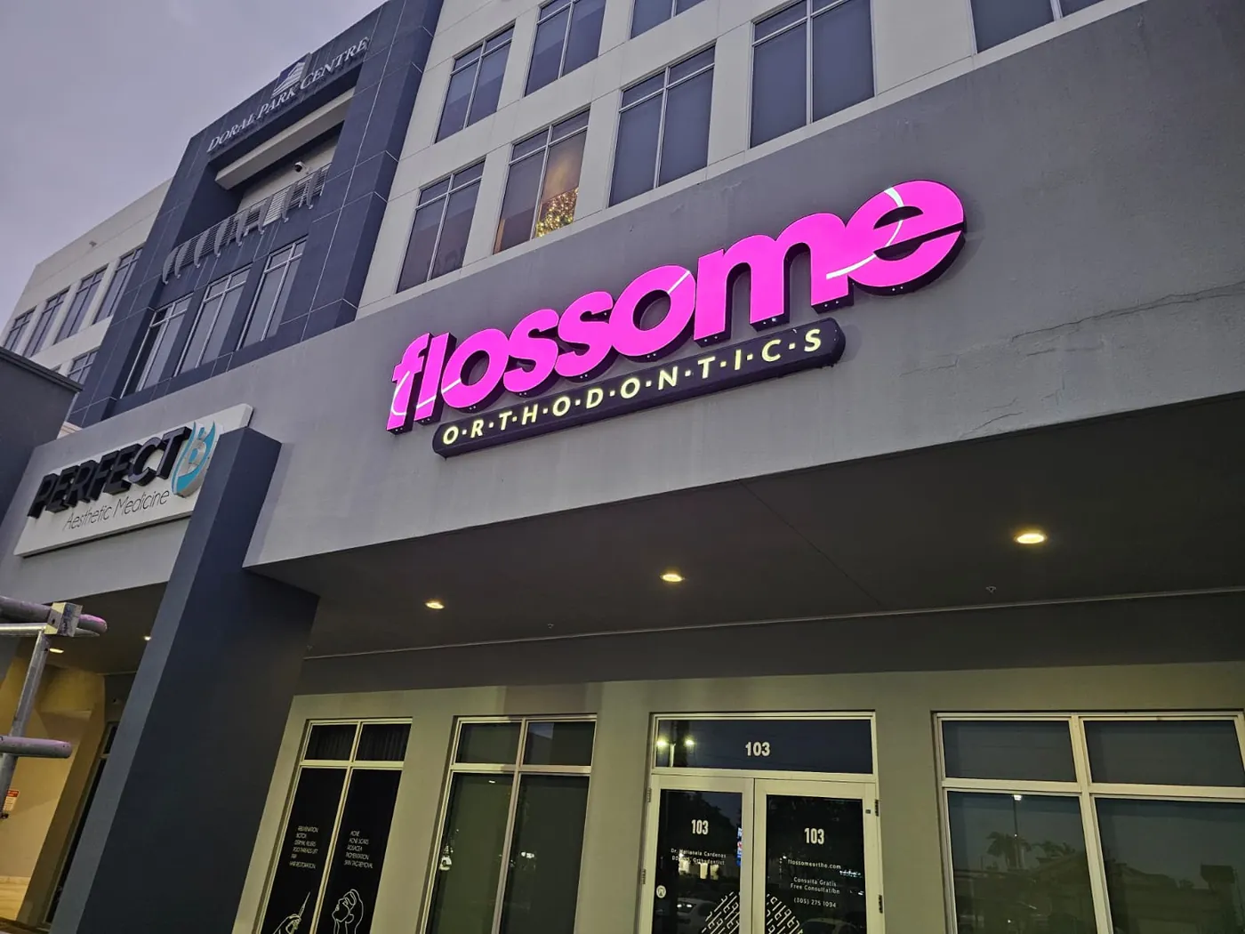 Illuminated channel letters on a building facade, made and installed by Spazio Design